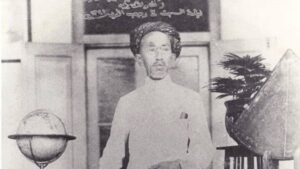 Gambar KH Ahmad Dahlan sedang memimpin pengajaran dengan latar sekolah Muhammadiyah sebagai simbol pembaruan pendidikan Islam